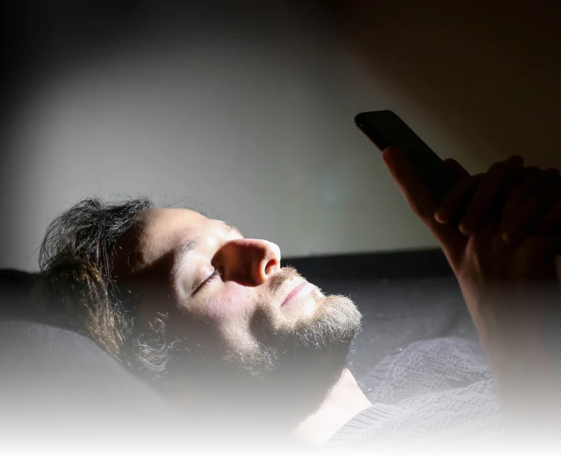Man relaxing with the Lumenate app