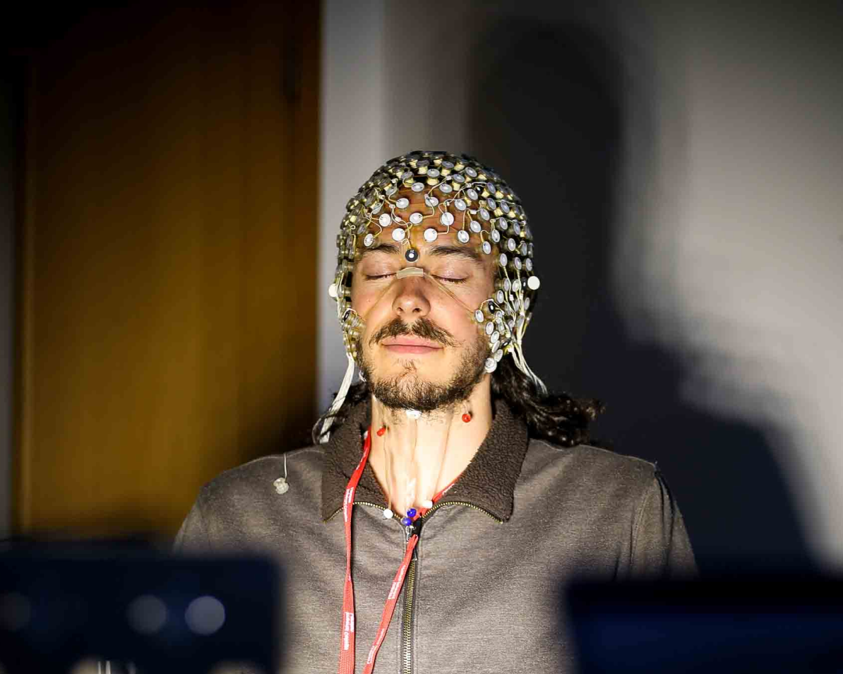 Man with EEG brain scanner on his head