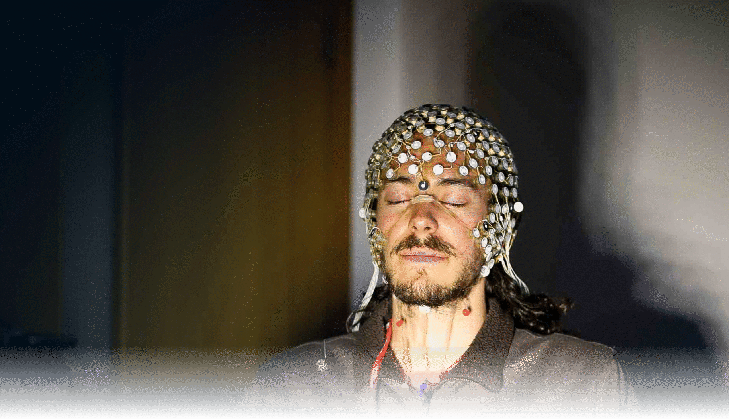 Man with EEG brain scanner on his head